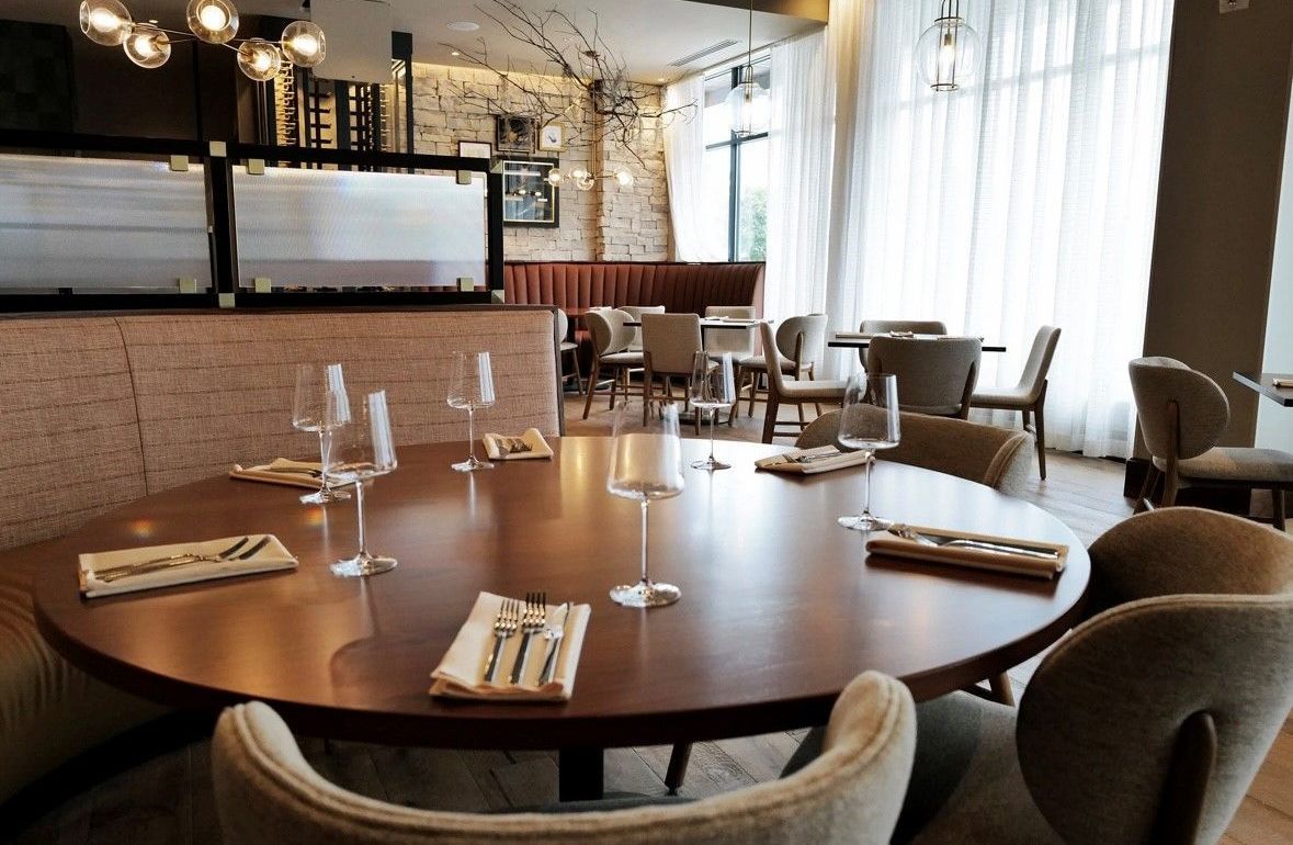 Tables and chairs set up for a meal.