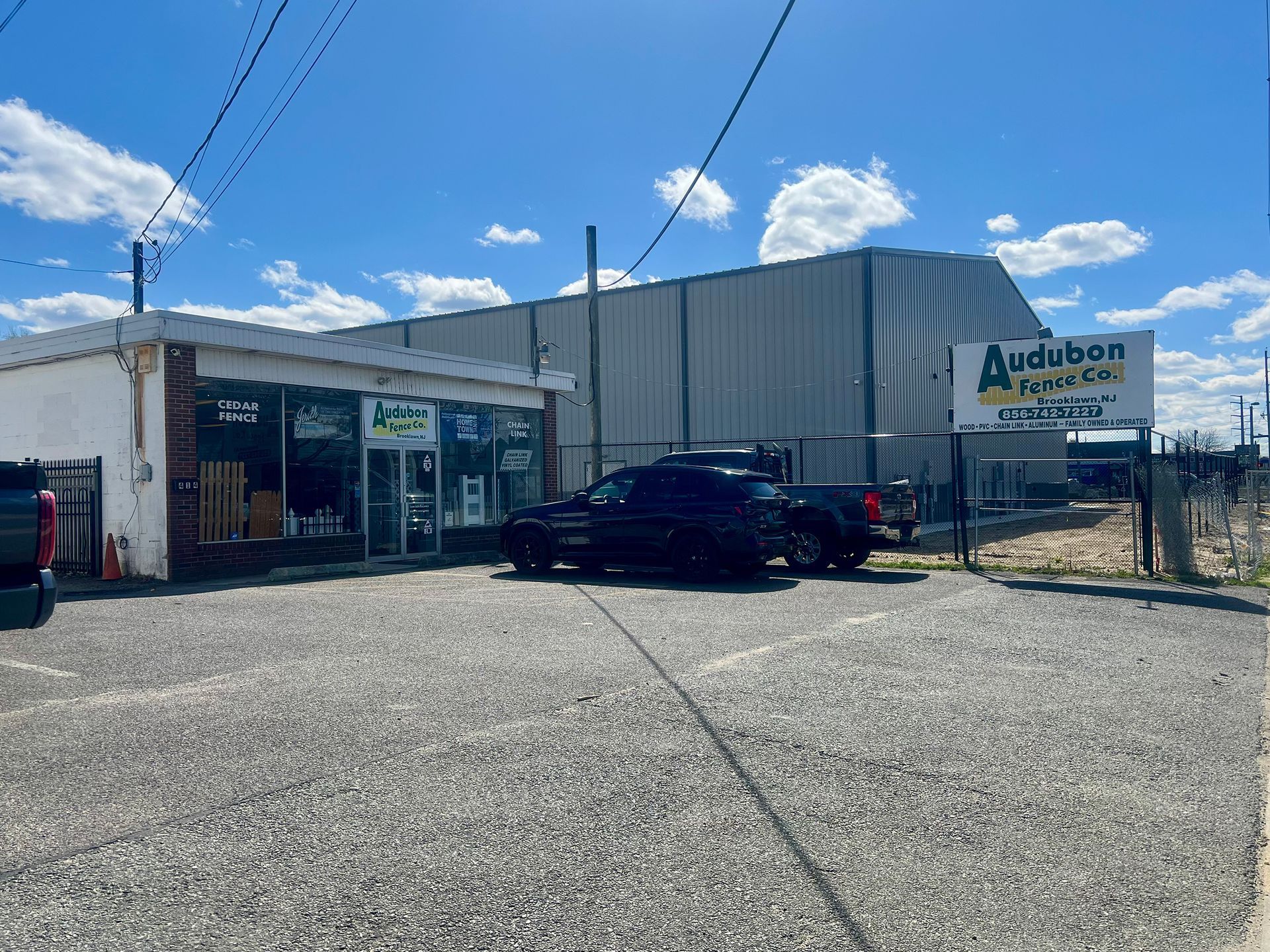 A truck is parked in front of a building.