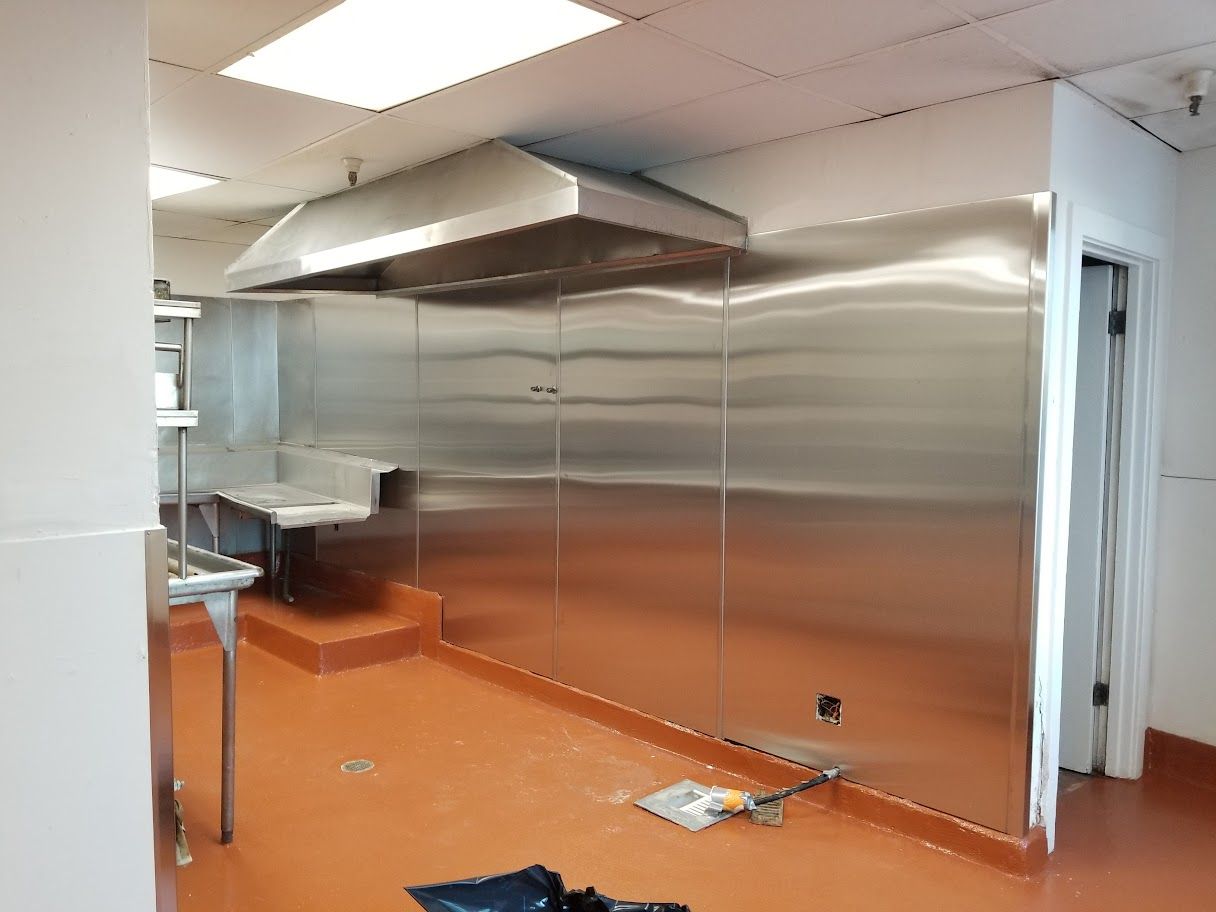 A kitchen with stainless steel cabinets and a sink.
