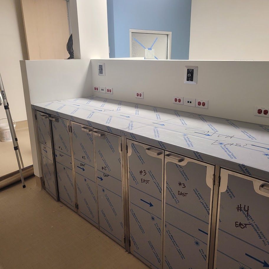 A kitchen with stainless steel cabinets and a countertop.