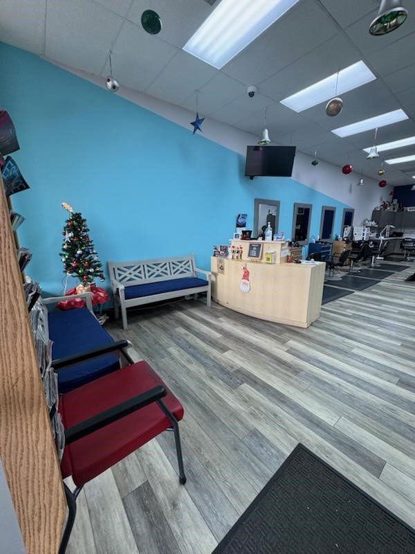 A waiting room with a bench and a Christmas tree