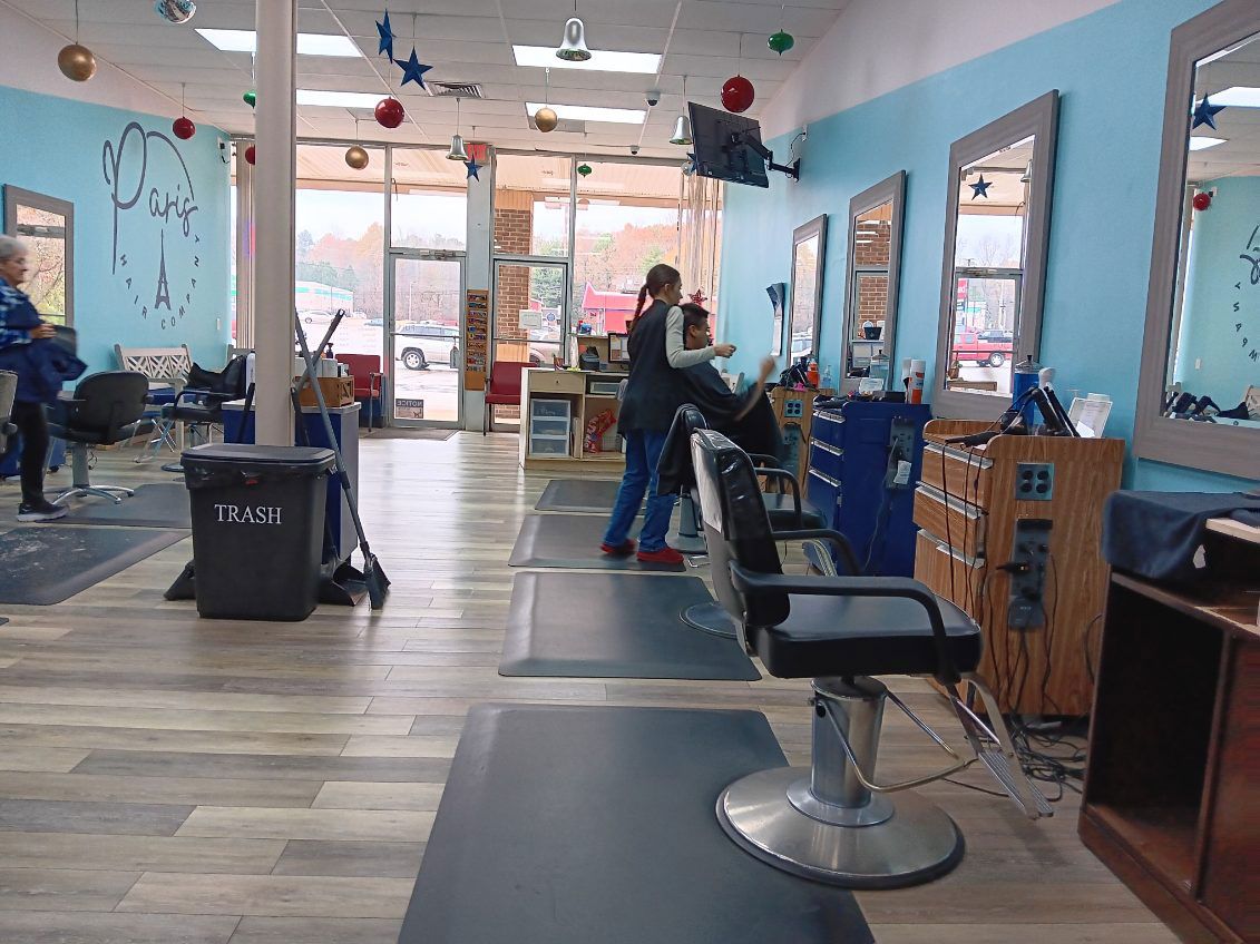 A man is getting a haircut in the salon