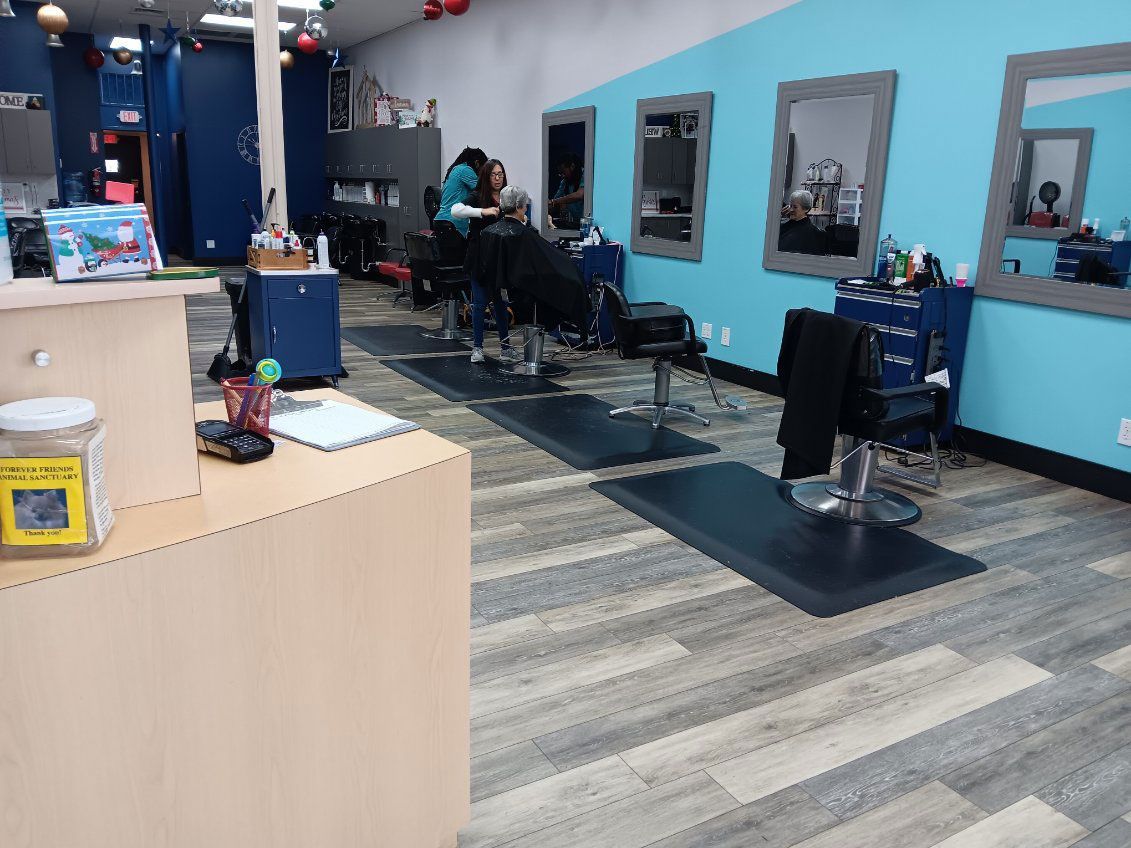 A woman is getting her hair cut