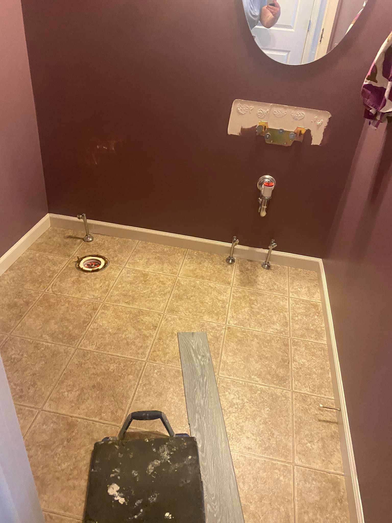 a before picture of a bathroom with a sink and a mirror on the wall