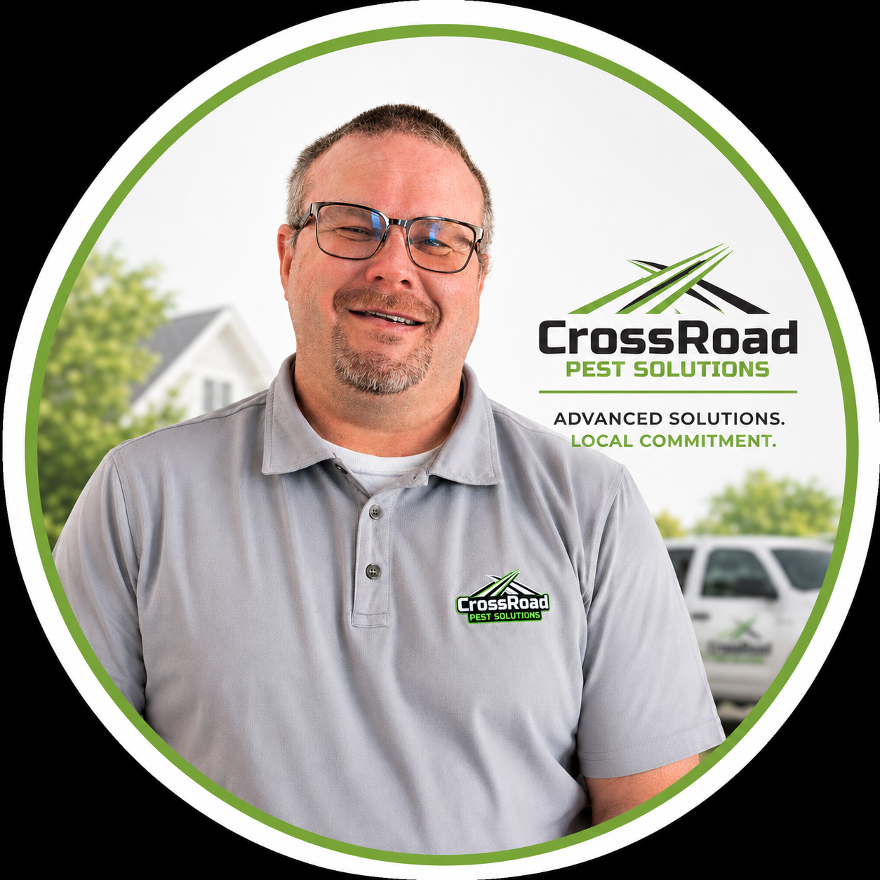 Smiling man in gray polo with CrossRoad Pest Solutions logo in front of branded backdrop
