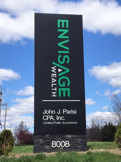 Sign for Envisage Wealth, black background, green text, John J. Parisi CPA. Inc. at 8008.