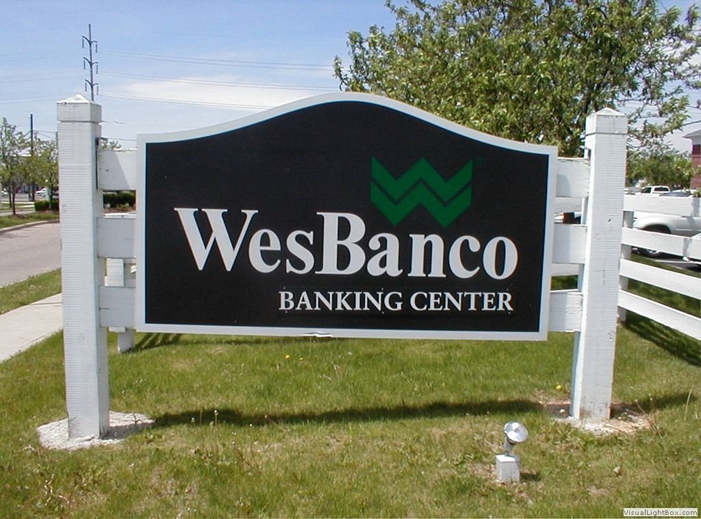 Sign for WesBanco Banking Center with a green logo and white lettering.