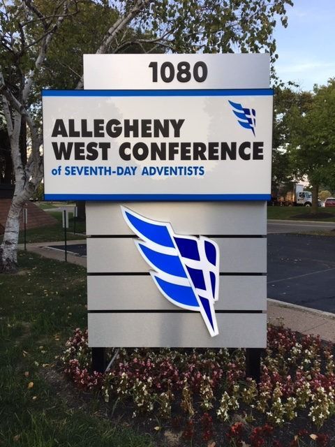 Sign for Allegheny West Conference of Seventh-Day Adventists, with address 1080, blue and white logo.