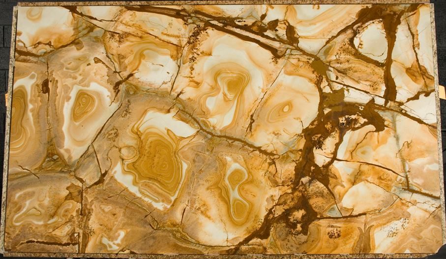 A close up of a piece of marble with a swirl pattern