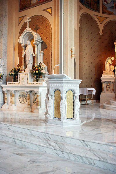 There is a statue of jesus on the altar in the church.
