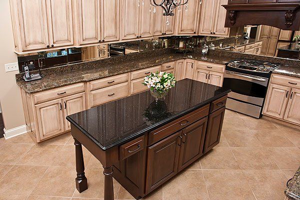 A kitchen with a large island in the middle of it