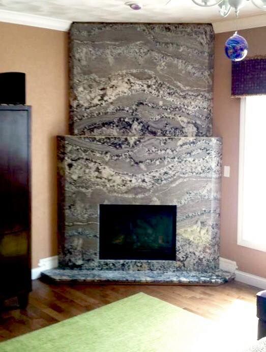 A living room with a fireplace and a green rug