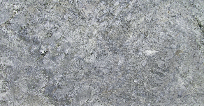 A close up of a gray granite counter top.