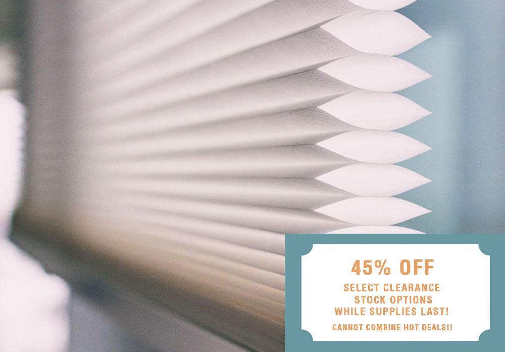 A close-up of a white blind with a sticker that says 45% off.