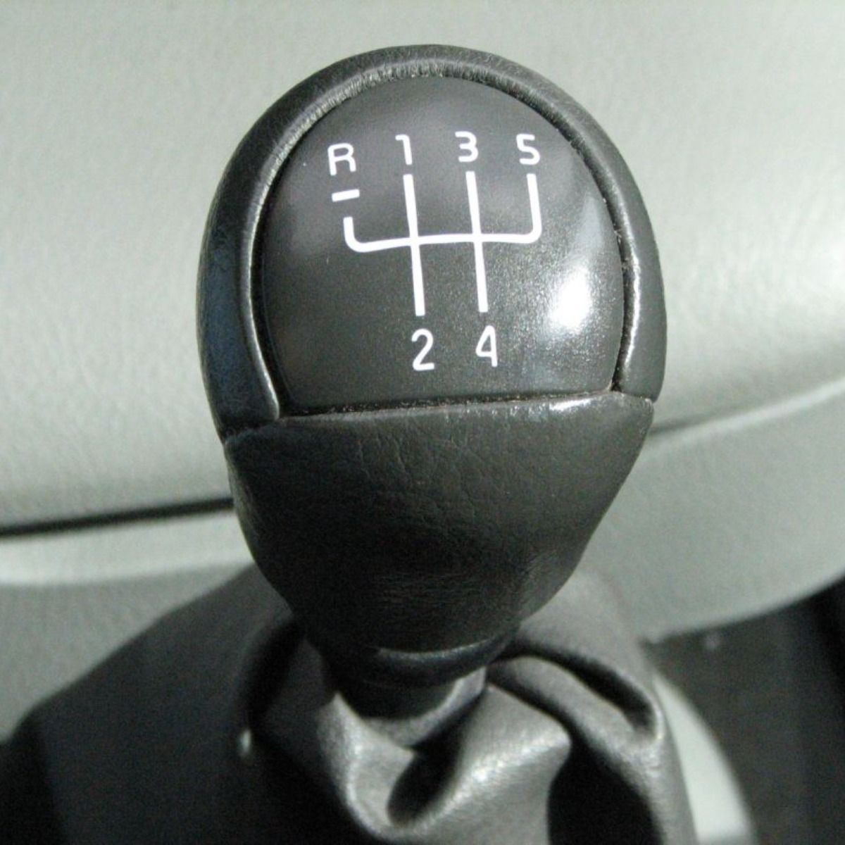 a close up of a car shifter with the numbers 1 through 4 on it
