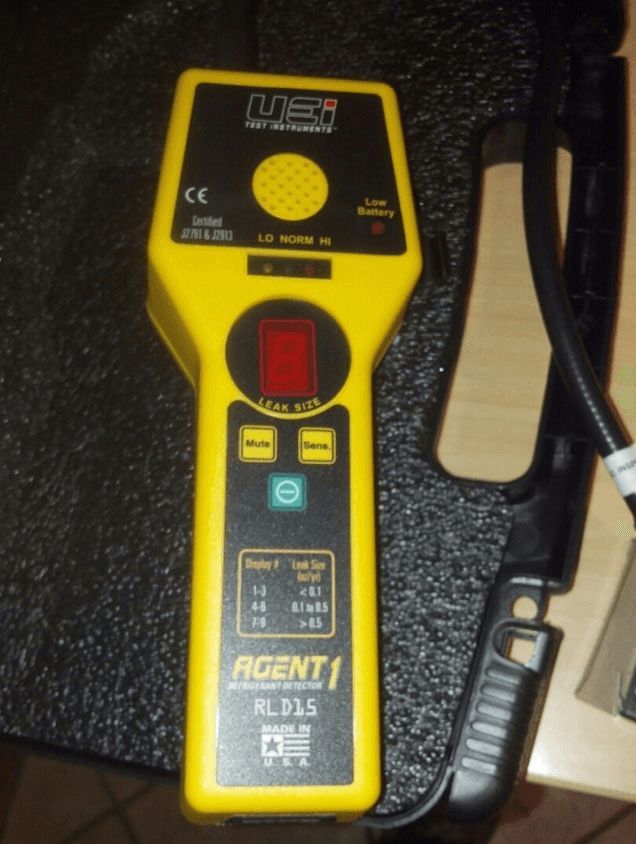 A yellow and black device that says agent on it