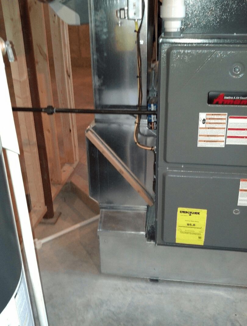 A gray box with a yellow sign on it that says