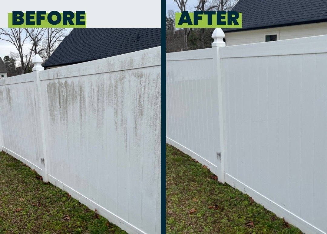 A sidewalk leading to a building with tables and umbrellas.