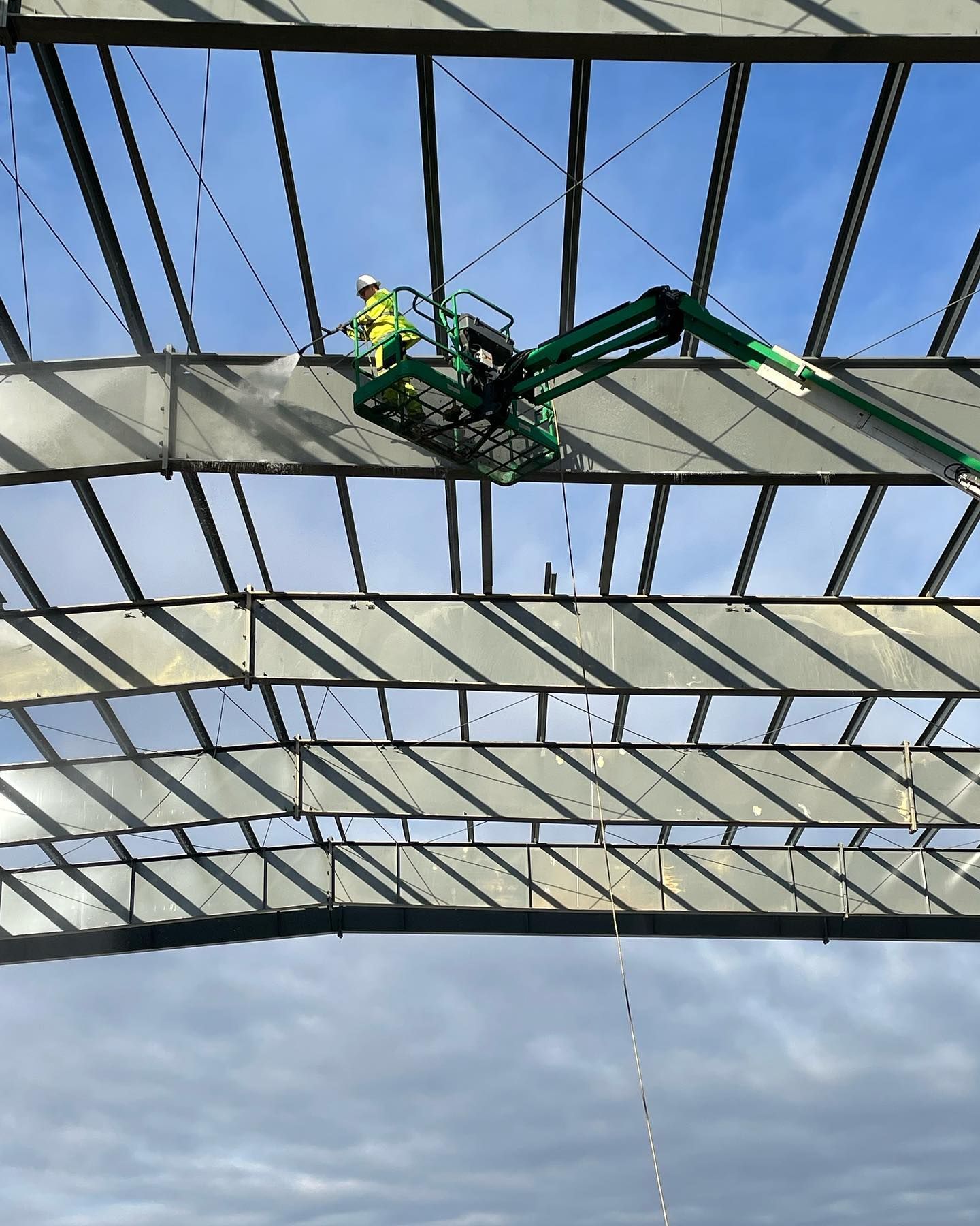 A before and after photo of a wooden deck.