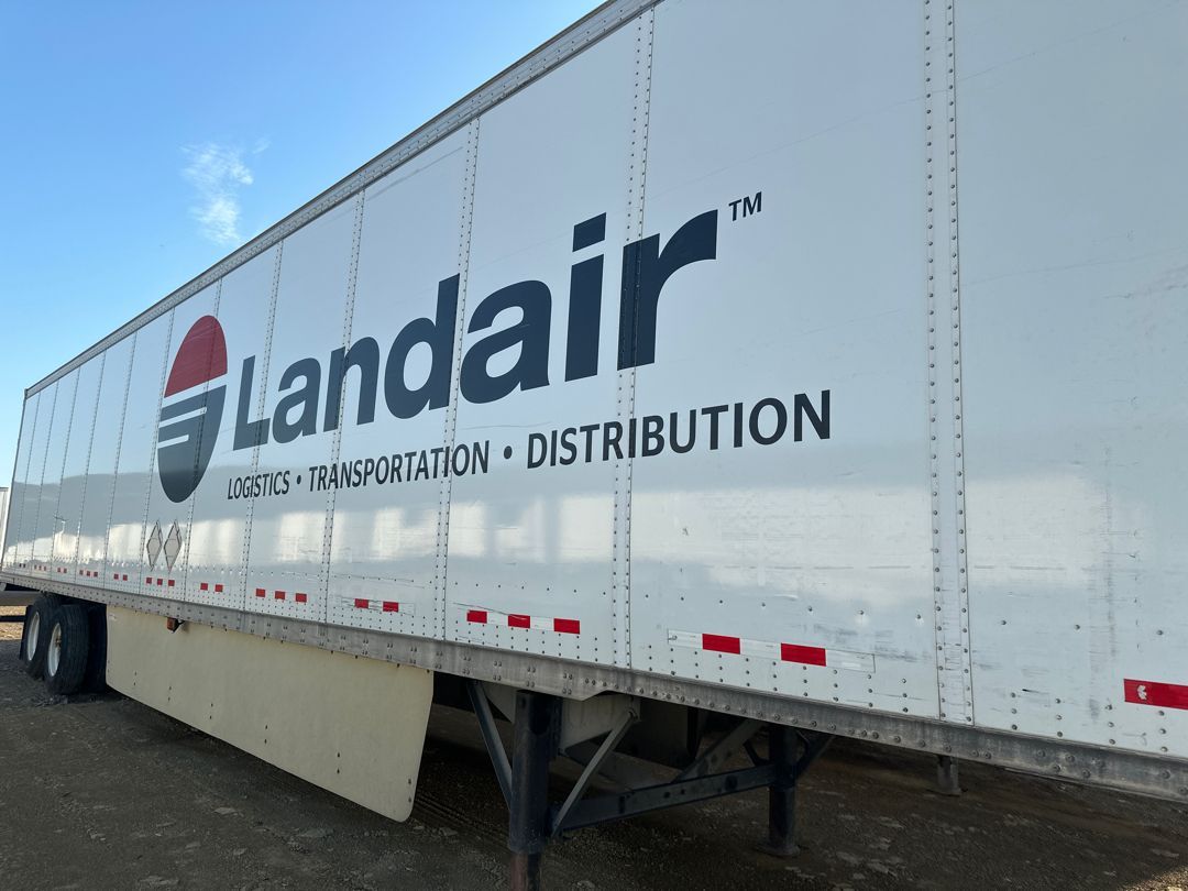 A white trailer with the word landair on it