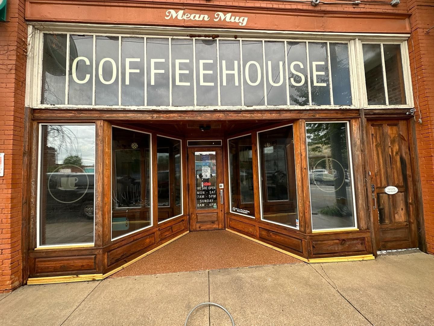The front of a coffeehouse with a sign that says coffeehouse on it.