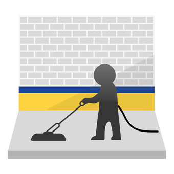 A man is washing concrete. 