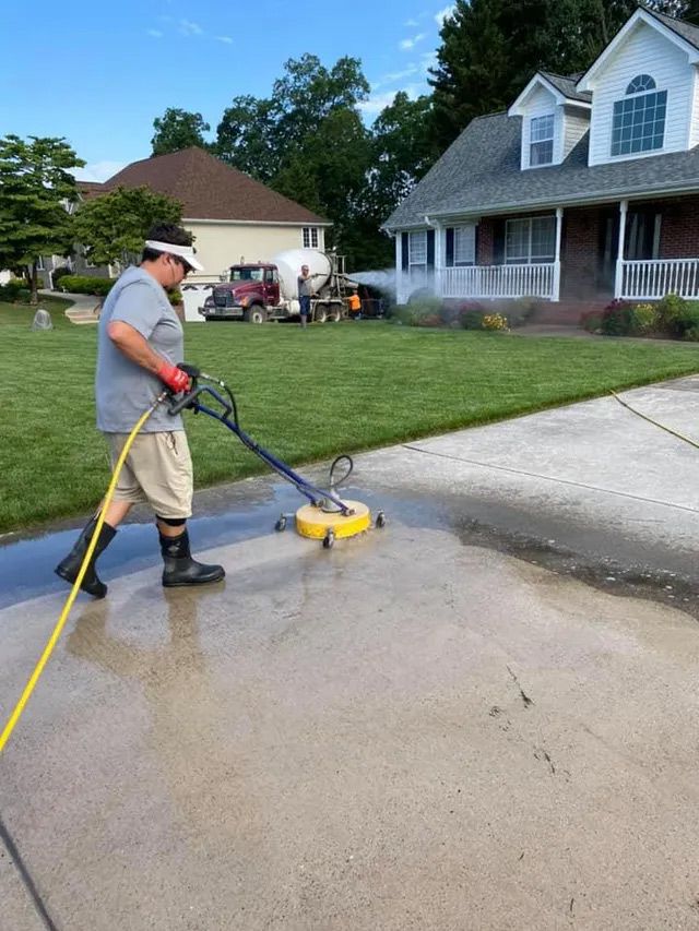 Power washing house driveway