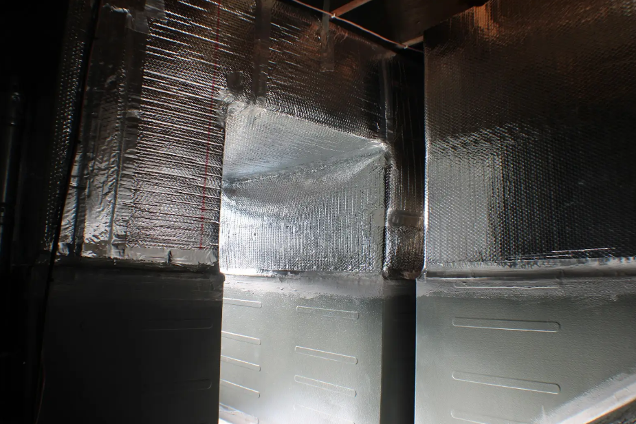 A room with a lot of aluminum foil on the walls and ceiling.