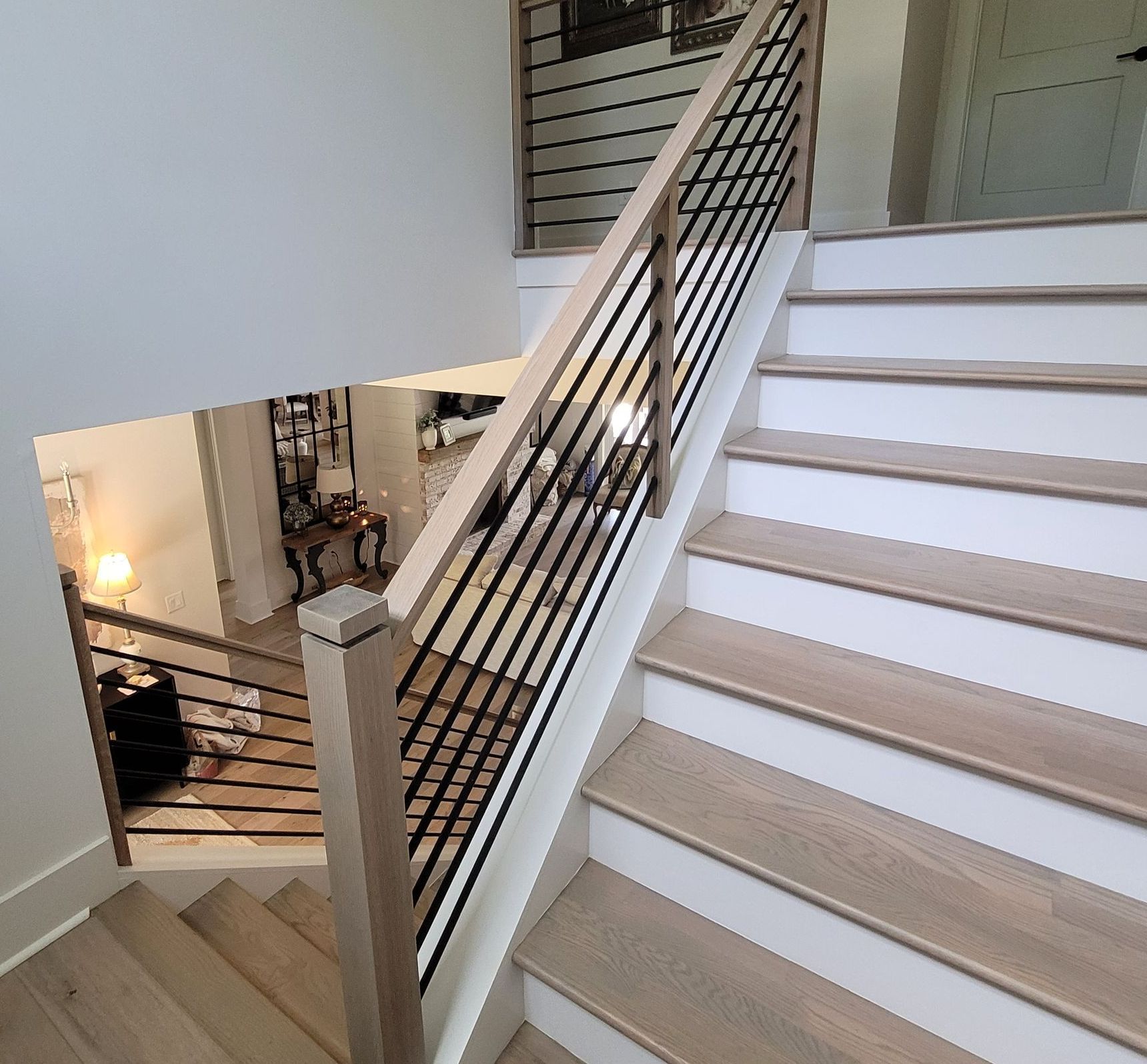 A staircase with wooden steps and a metal railing