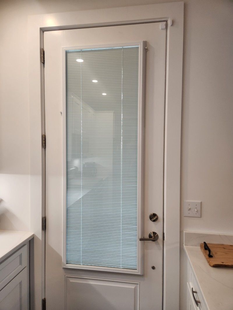 Blind between glass on entry doors