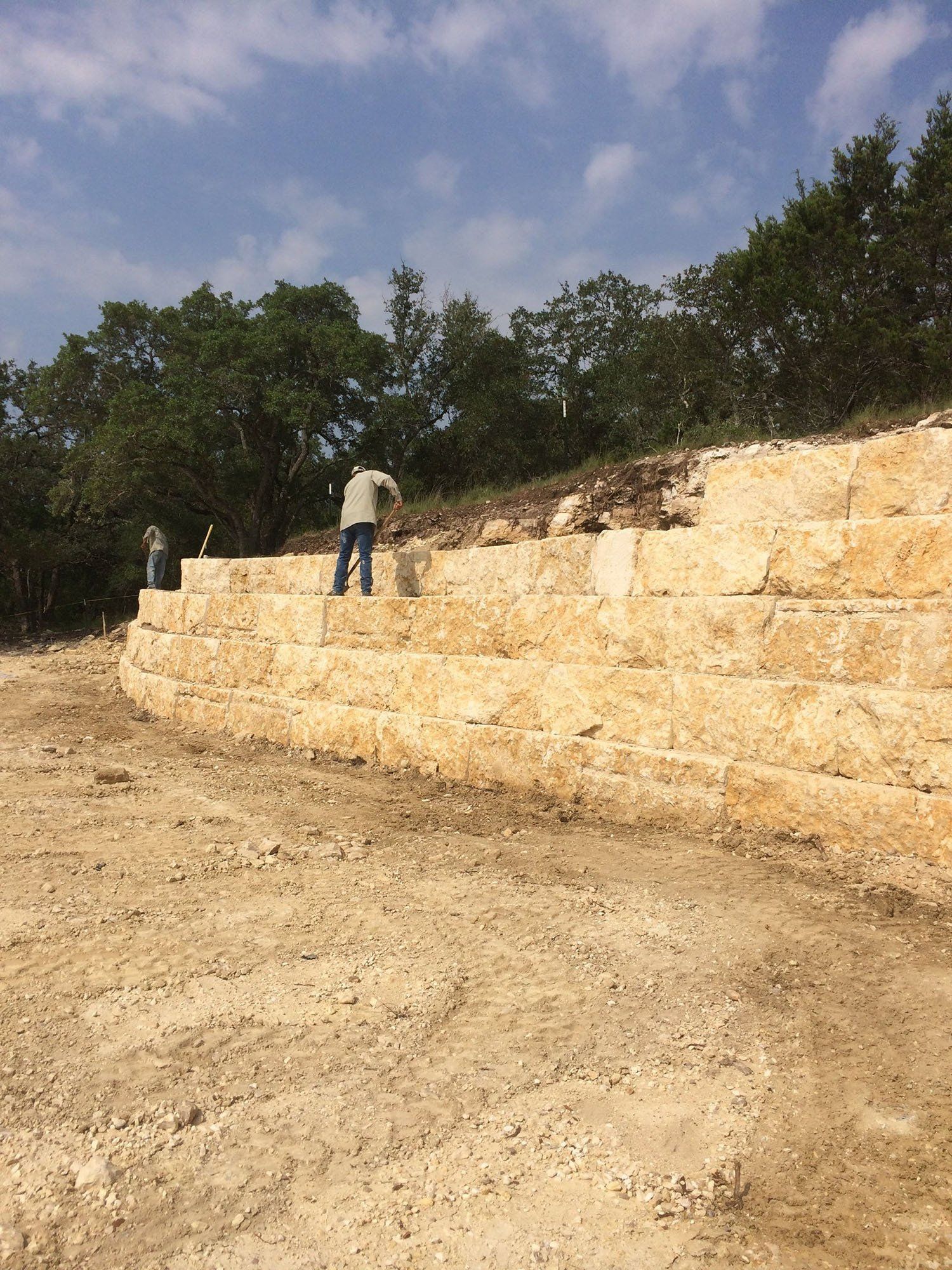 Landscape crew working on a retaining wall