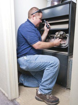 Guy doing maintenance on HVAC