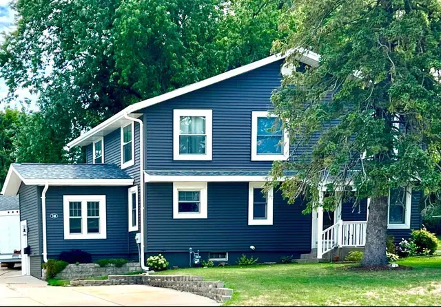 Blue Siding & New Gutters