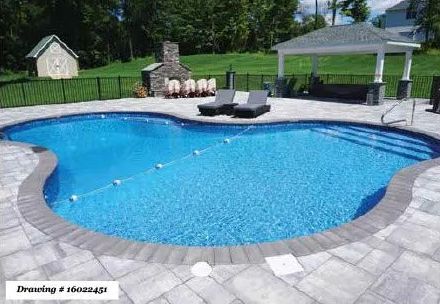 A blue, kidney-shaped swimming pool with a stone patio, two lounge chairs, a stone fireplace, and a covered pavilion.