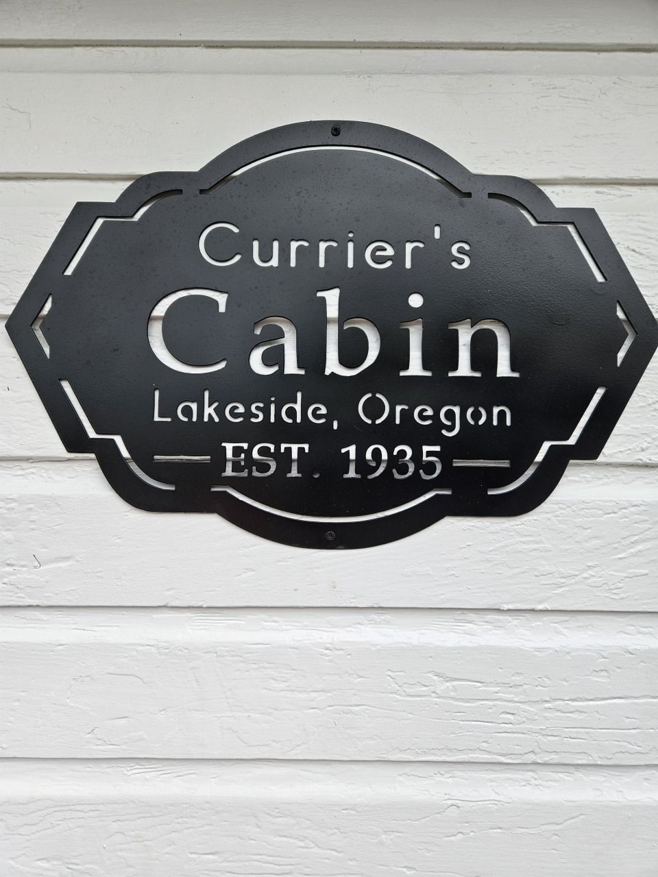 Black metal sign for