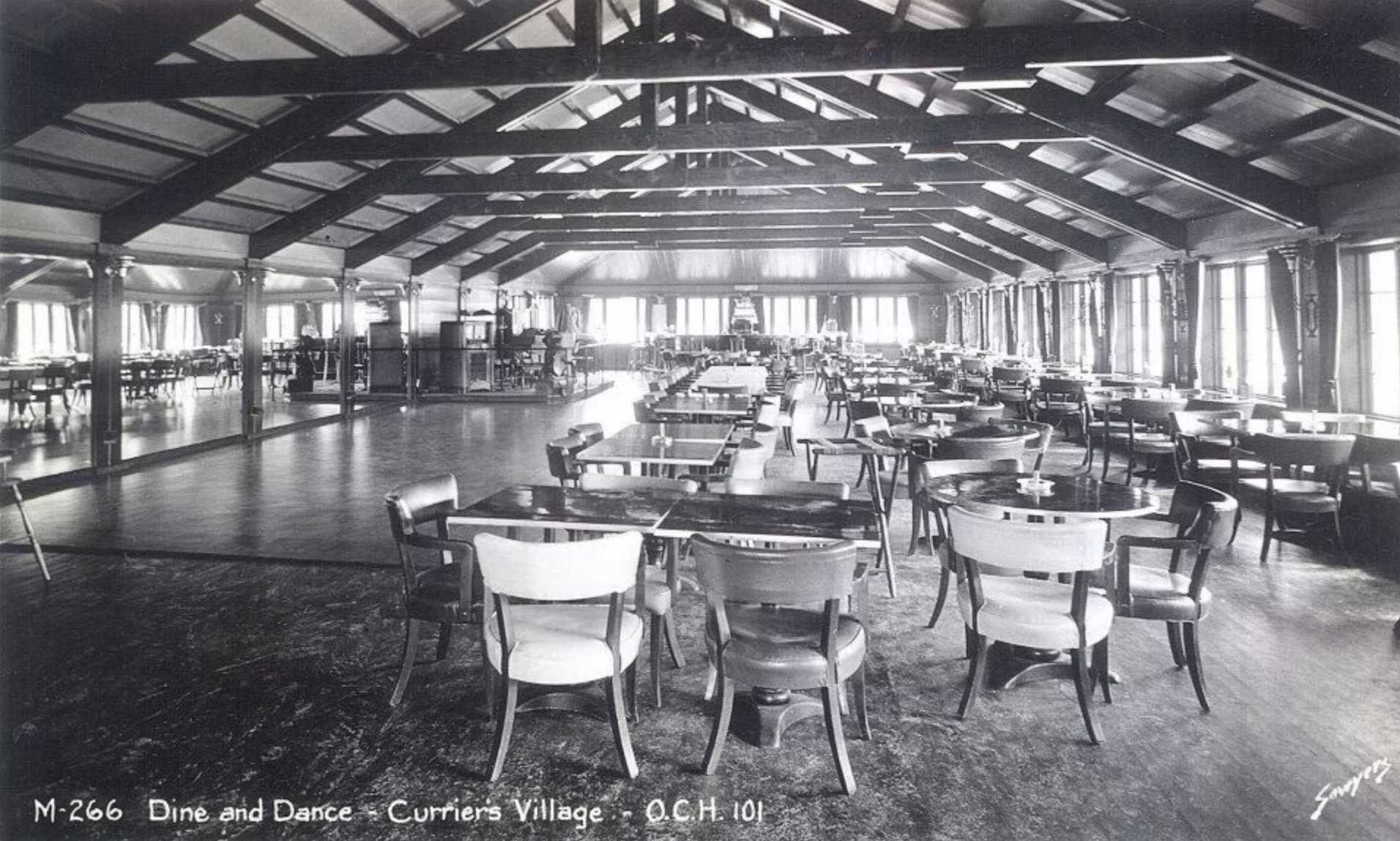 dining hall interior with tables and chairs, wooden ceiling, windows, and floor
