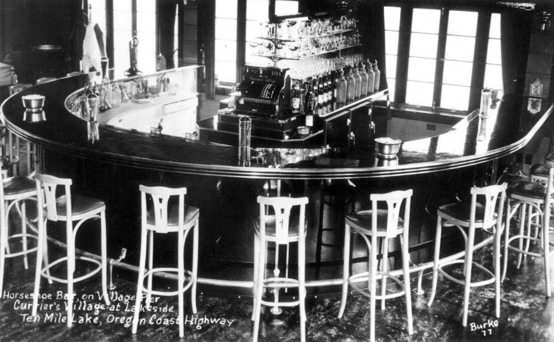 round bar with high stools and bottles lined up