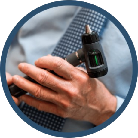 A man in a tie is holding a device in his hand
