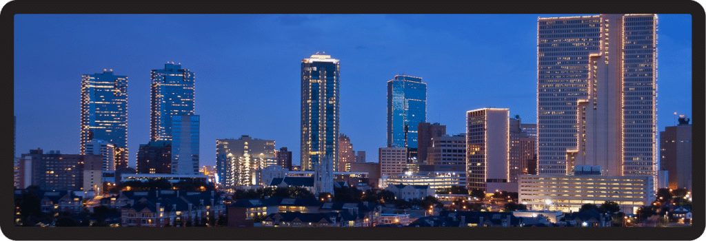 A picture of a city skyline at night