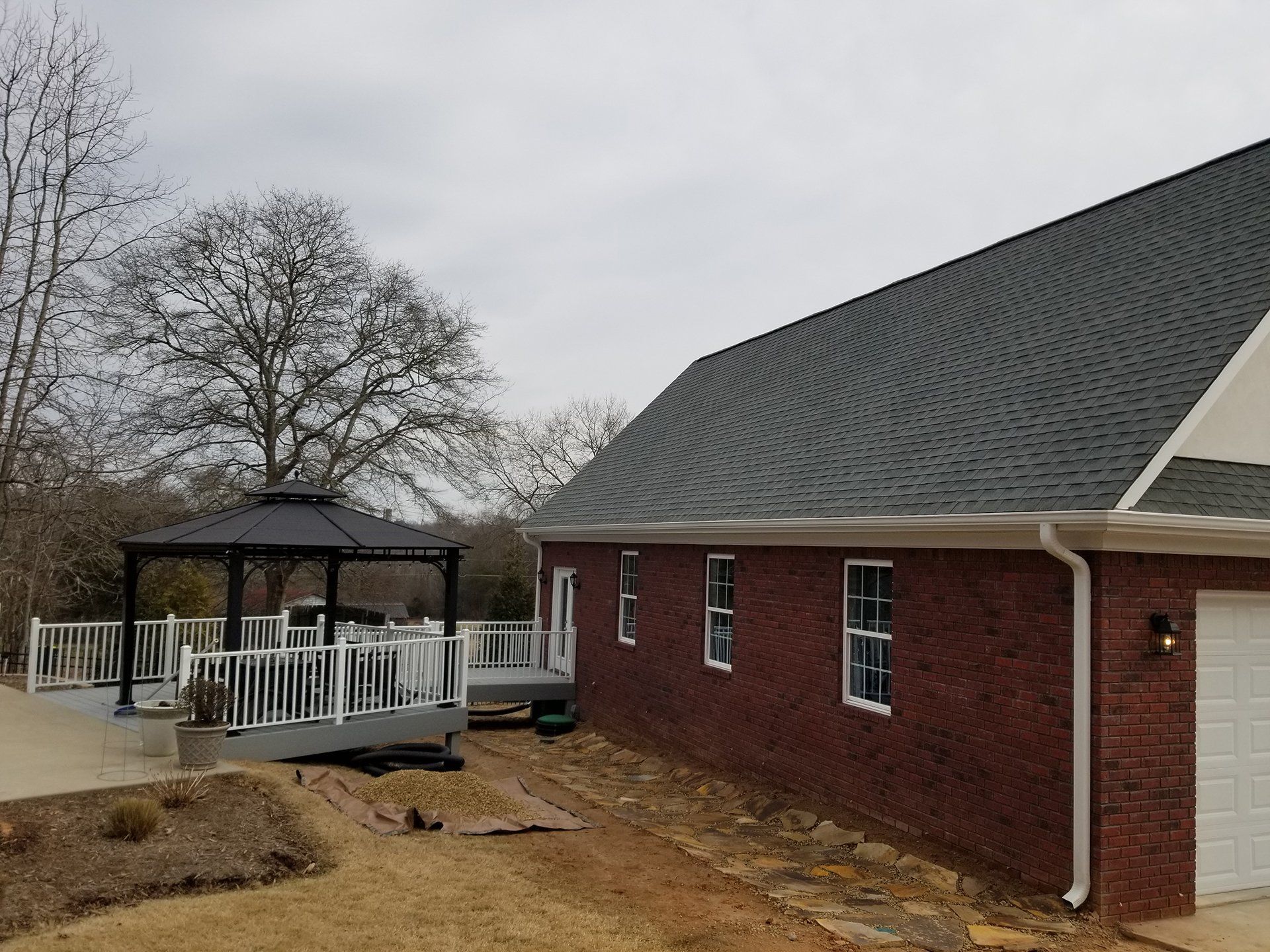 white fenced patio and deck