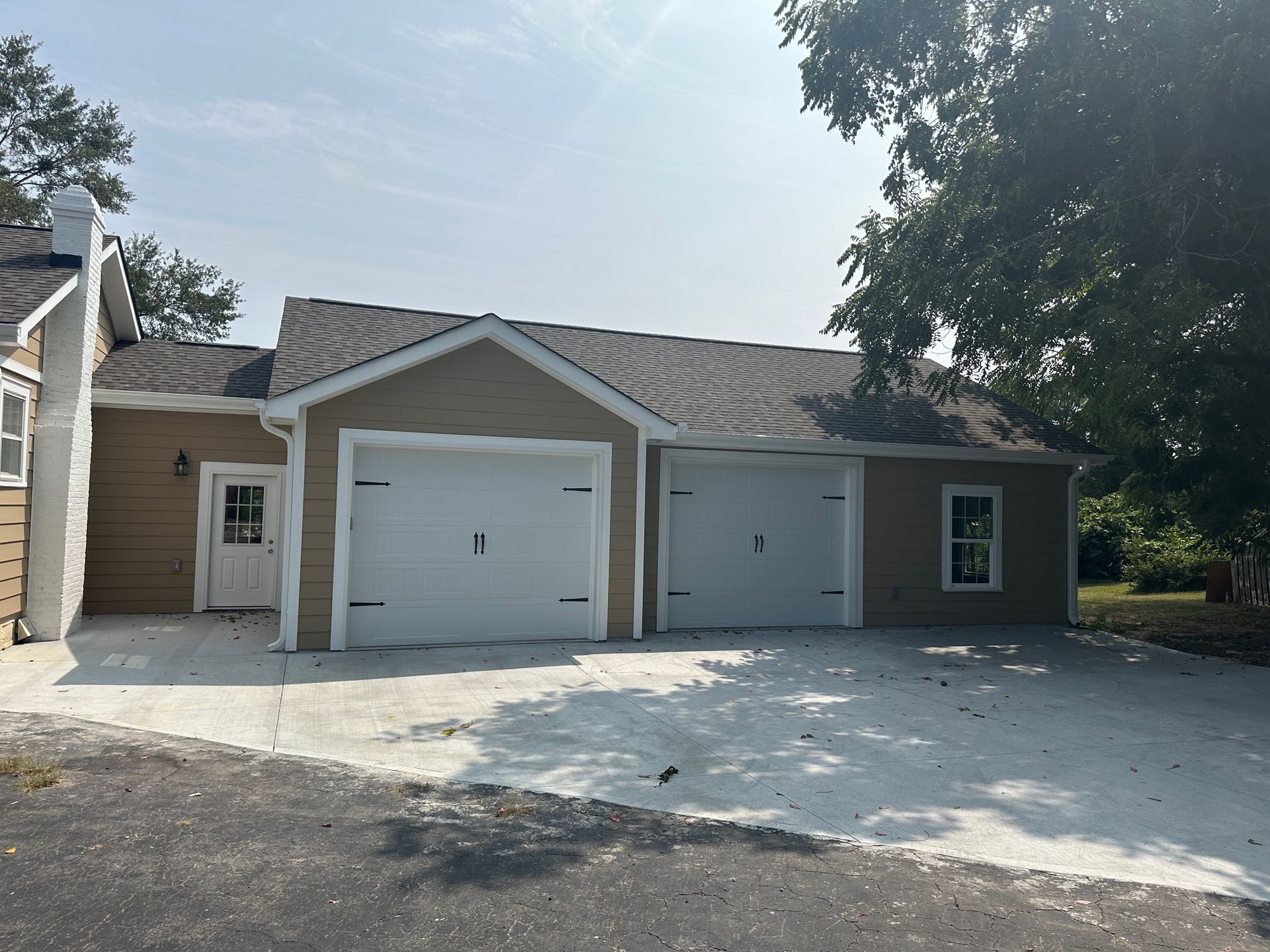 A house with two garage doors and a driveway