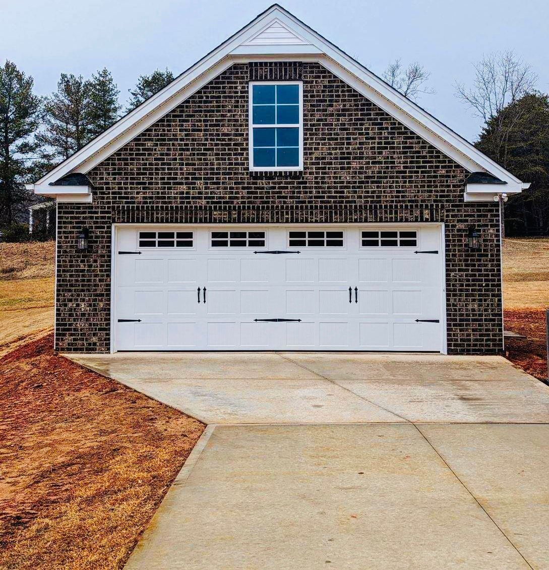 A garage with a white door and a window