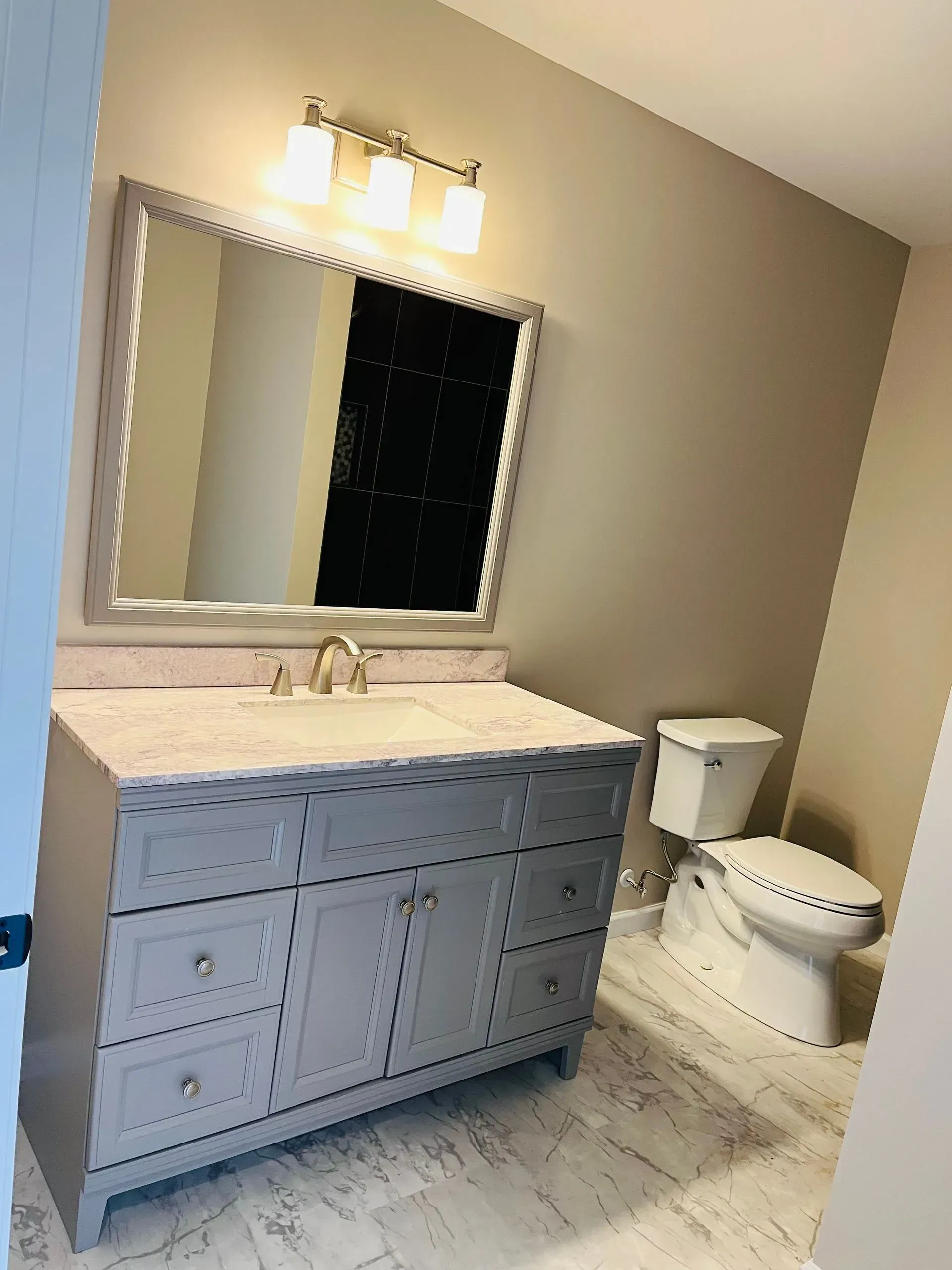 Bathroom with mirror and cabinets