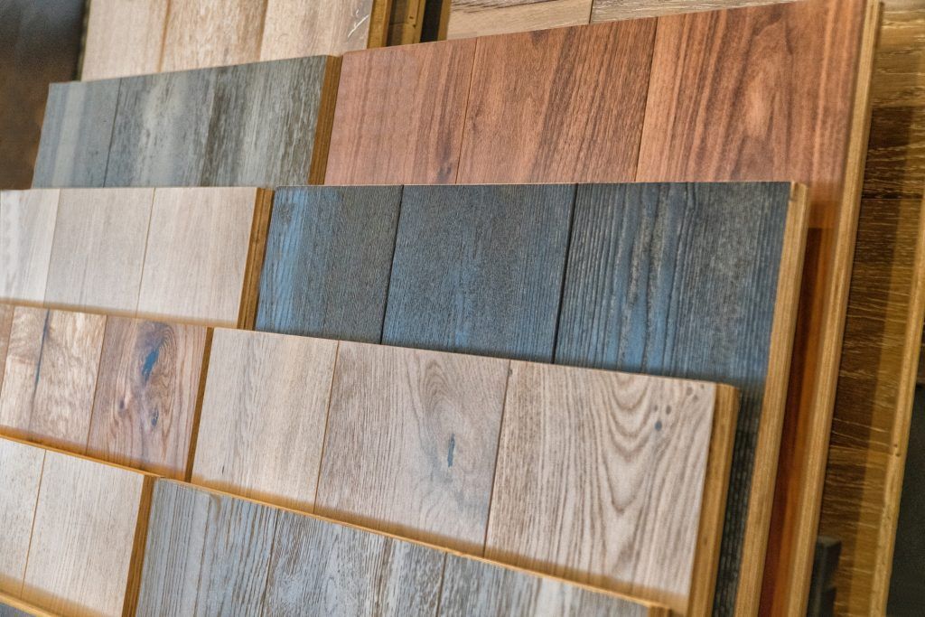 A stack of wooden boards with different shades of wood