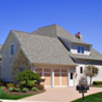A large house with a mailbox in front of it.