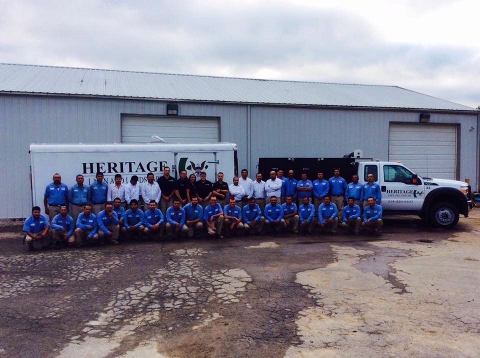 A group of people posing in front of a heritage truck