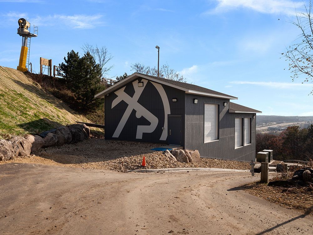 A black and white building with a large x on it
