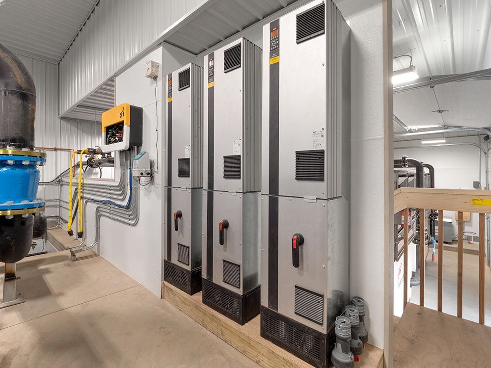 A room with a lot of electrical equipment in it.