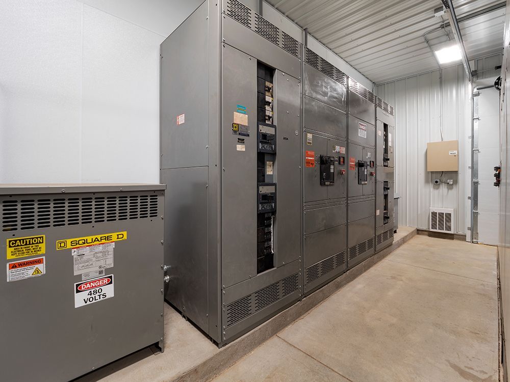 A room with a lot of electrical equipment in it.