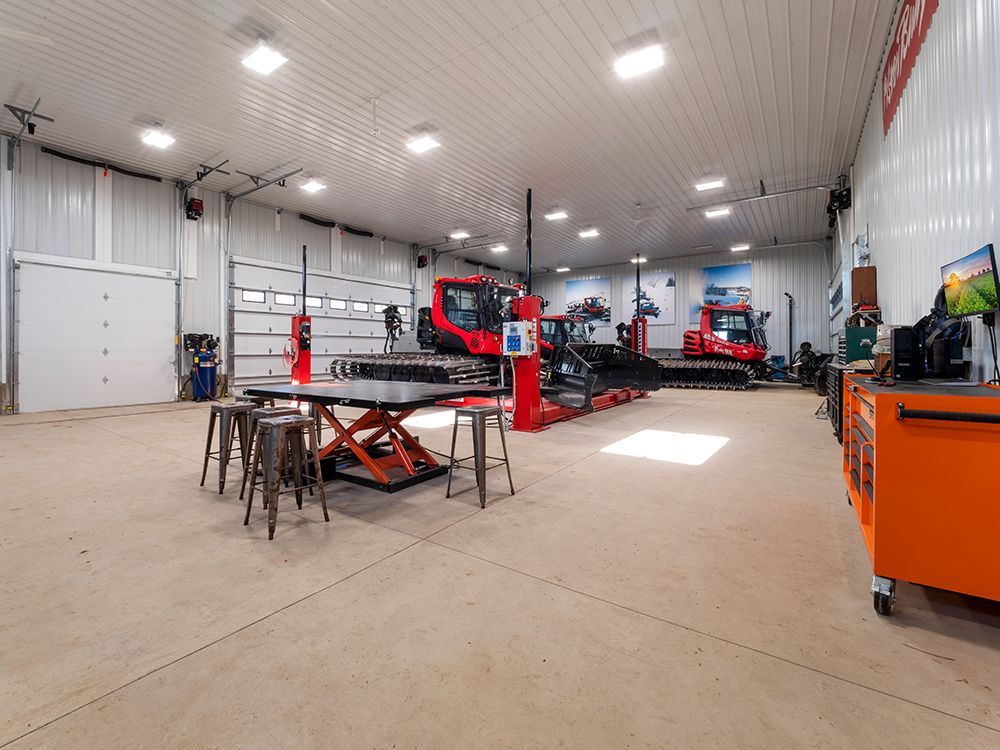 A large warehouse with a lot of machinery in it.